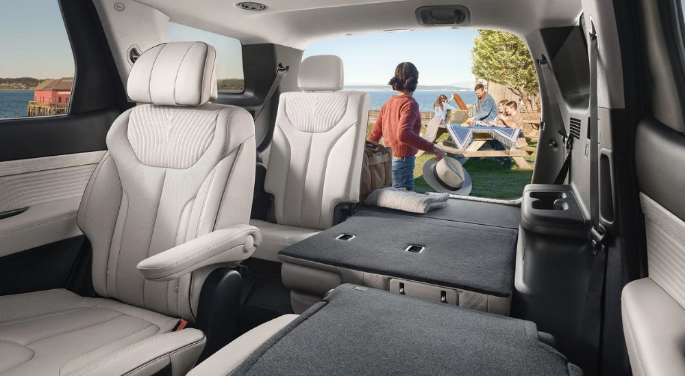 The rear cargo area and fold-down seats in a 2025 Hyundai Palisade.