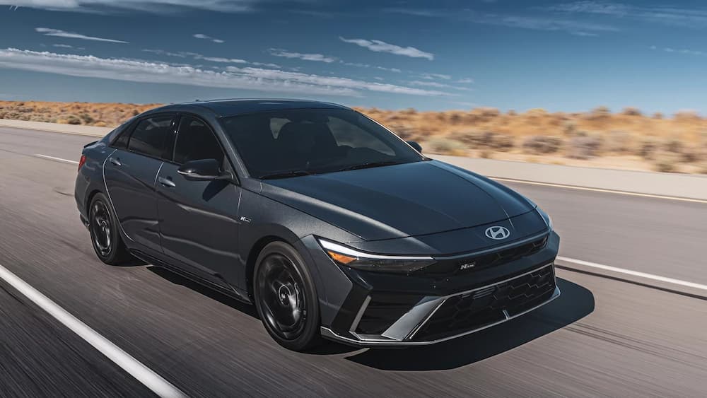 A gray 2025 Hyundai Elantra N-Line driving on a highway.