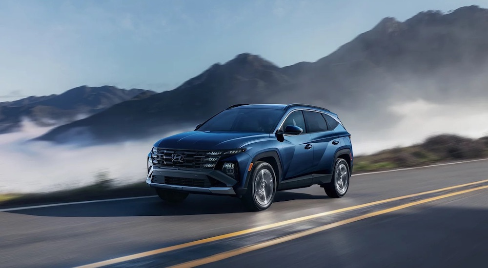 A blue 2026 Hyundai Tucson from the side.