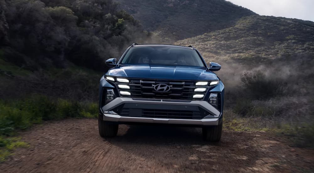 Front grille on a blue 2026 Hyundai Tucson off-roading