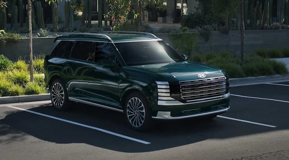 A parked green 2026 Hyundai Palisade.
