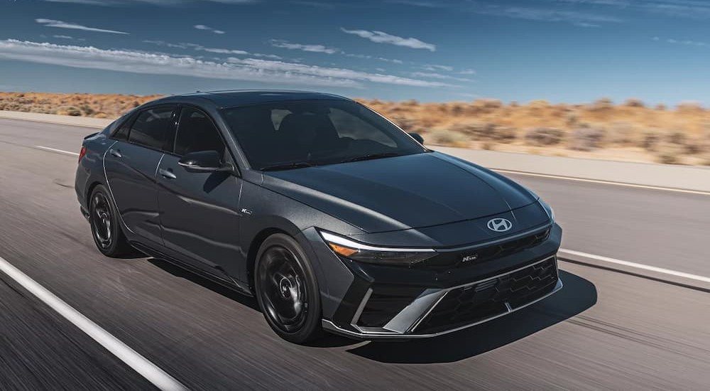 A gray 2026 Hyundai Elantra N-Line driving on a highway.