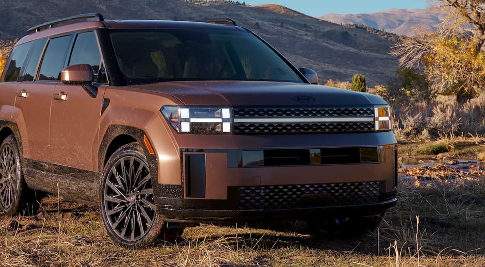 Copper 2026 Hyundai Santa Fe parked in a field