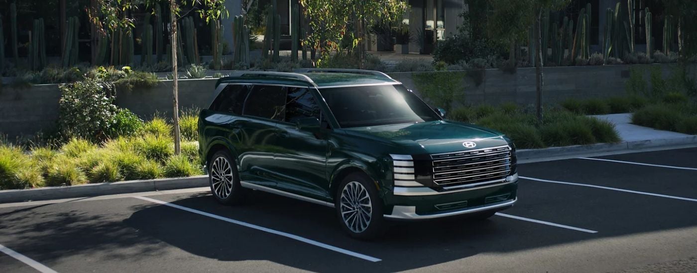 Emerald 2026 Hyundai Palisade backed into a parking spot.