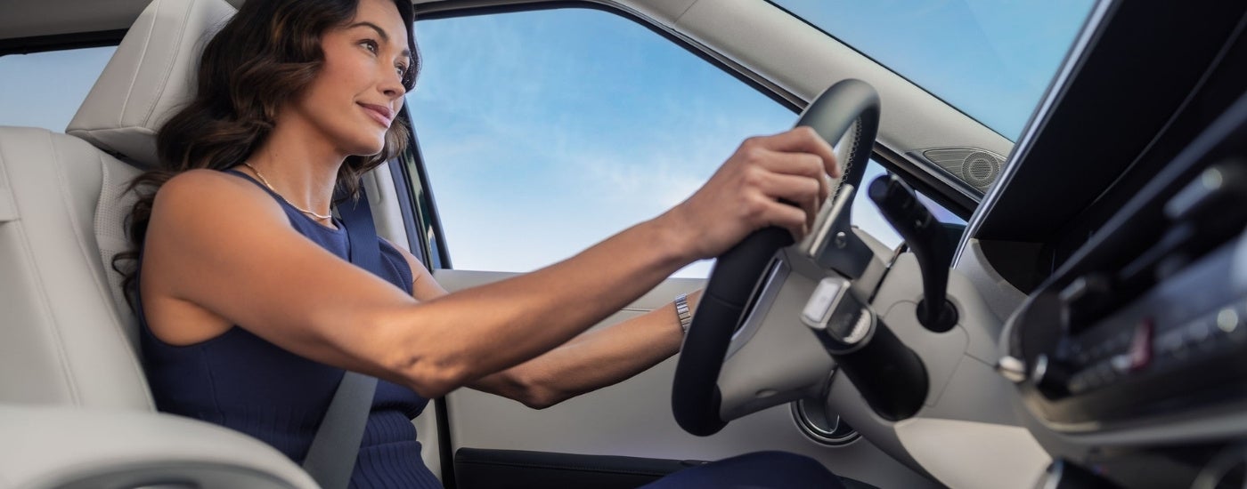 Person driving a 2026 Hyundai Palisade HEV