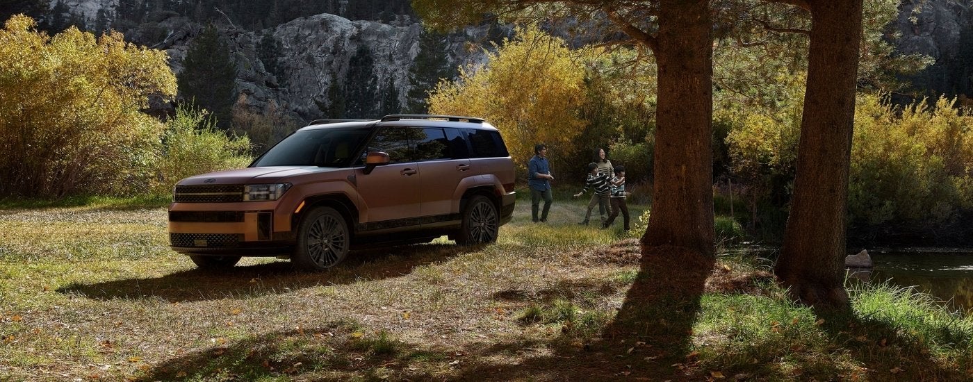 Brown 2026 Hyundai Santa Fe HEV Limited parked off-road