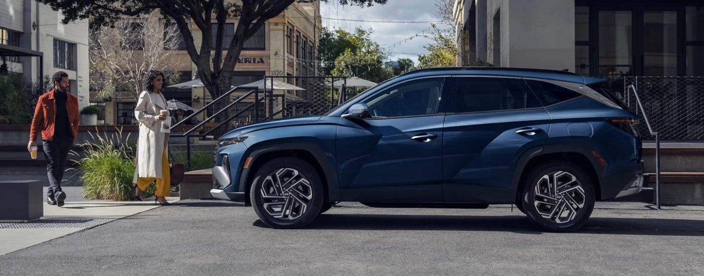 Blue 2026 Hyundai Tucson Limited parked on a city street