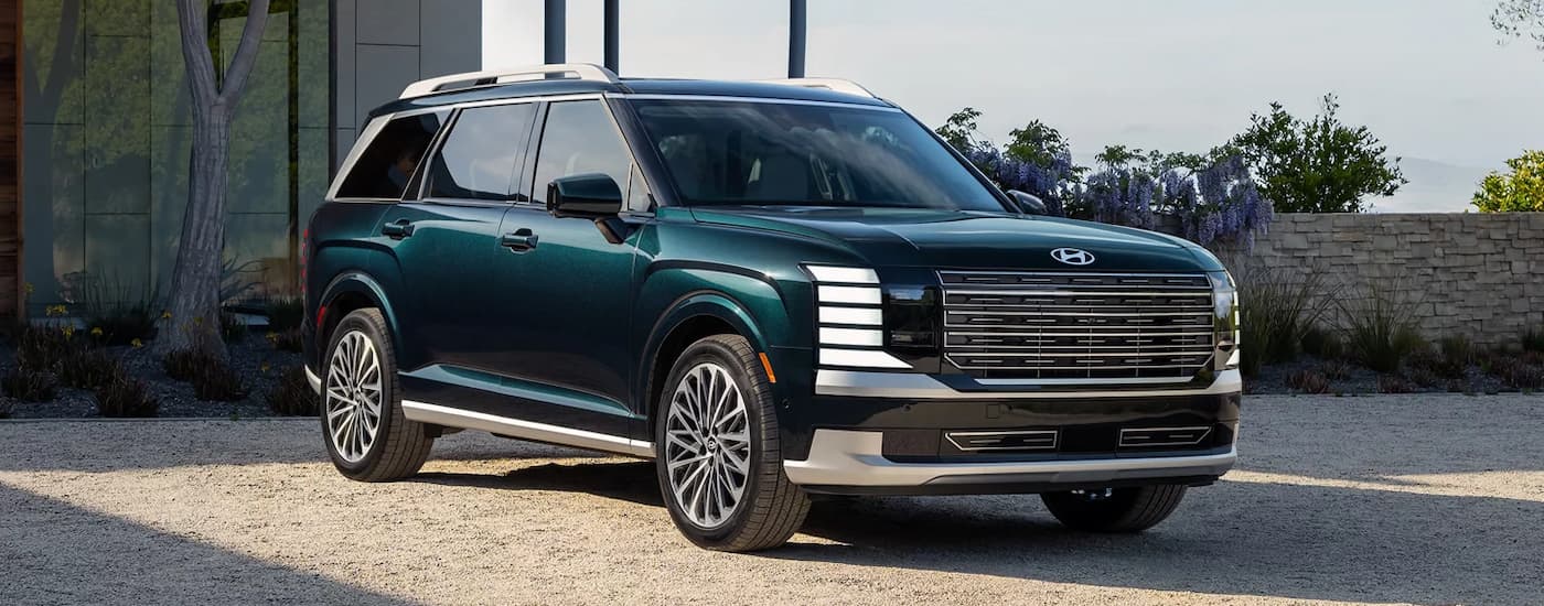 Green 2026 Hyundai Palisade for sale near Libertyville parked outside a house.