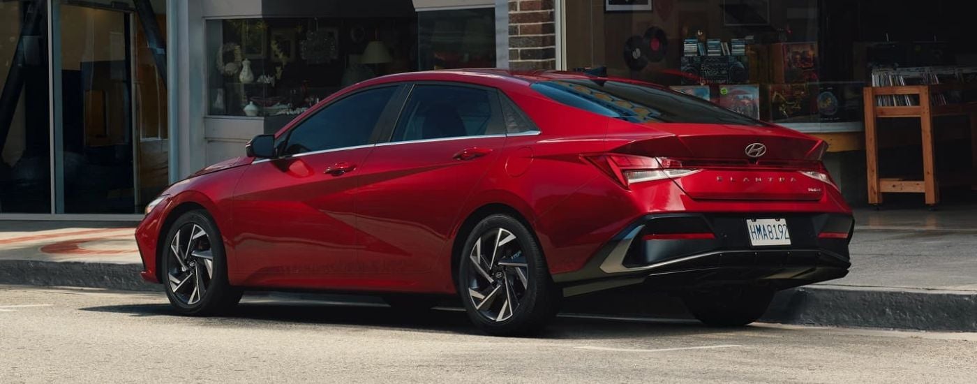 A red 2025 Hyundai Elantra parked in a city